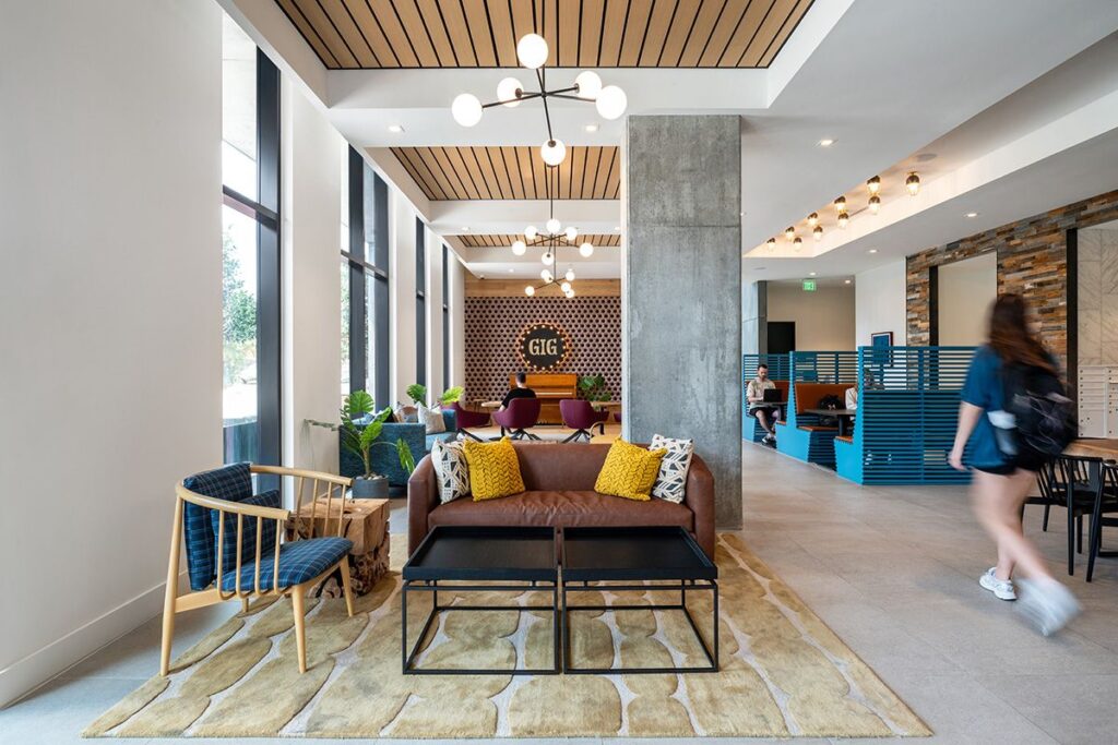 Rev Student Living Indoor Lounge with Comfortable Seating and Coffee Table 1