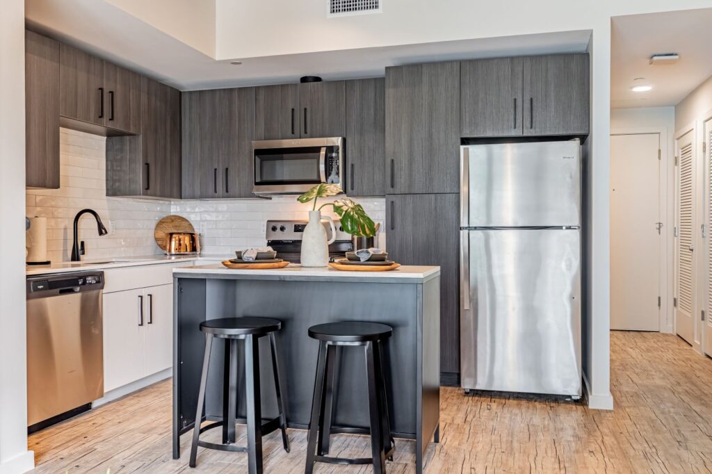 Rev Student Living Kitchen with Stainless Steel Appliances and Gray Cabinets